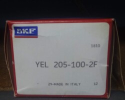 A box with a yel bearing in it.